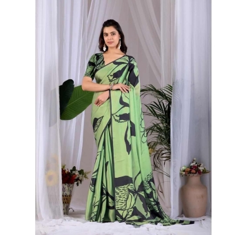 Woman Wearing Pista Green and Black Abstract Printed Satin Georgette Saree