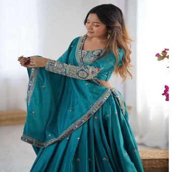 Front view of teal green Chinon lehenga choli with embroidery sequence work dupatta