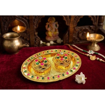 gold pink green oval kankavati kumkum plate with ornamental design for pooja