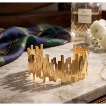 Stainless steel gold-plated cuff bracelet by SOLMARE VENTURES