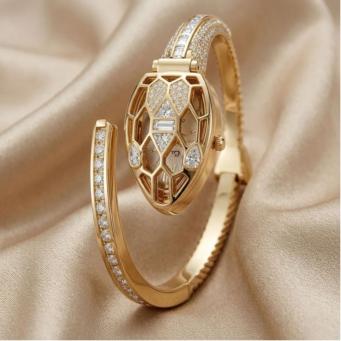 Celeste crystal hidden dial gold bracelet watch with elegant design